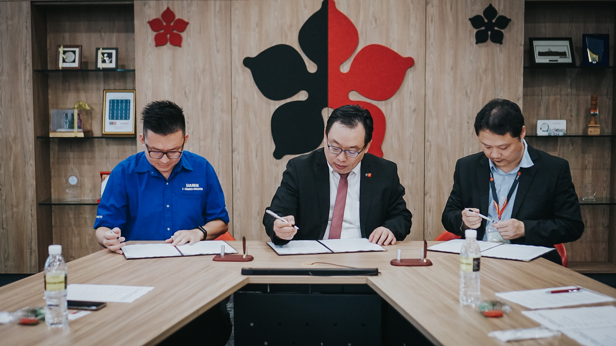 (From left) Mr Chew, Professor Lau and Professor Wong sign the MoU.