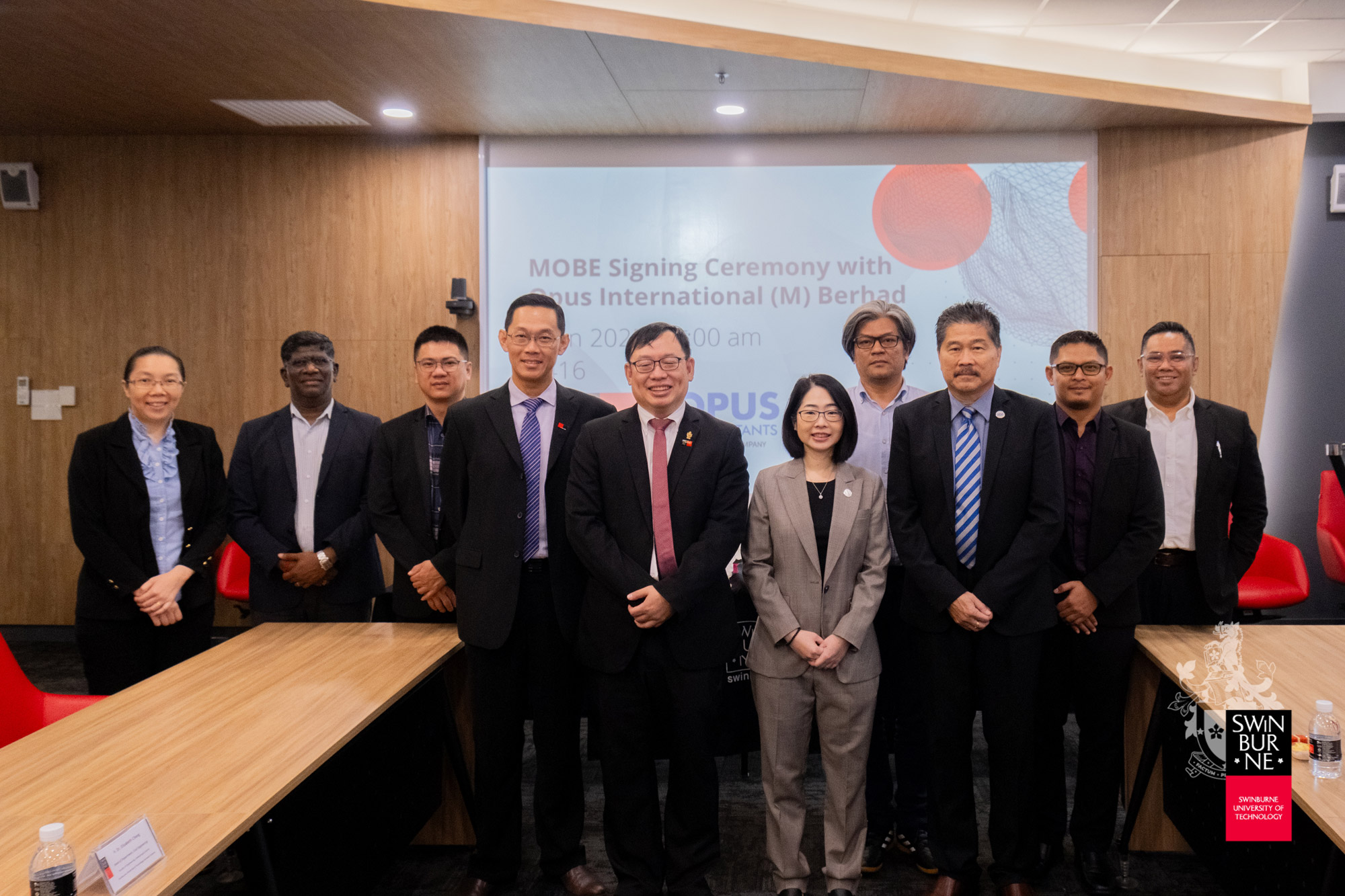 A group photo taken at the MOBE signing ceremony between Swinburne Sarawak and OPUS, with Ir Professor Lau Hieng Ho (fifth left), Ms Hillary Chua (fifth right) and others. 