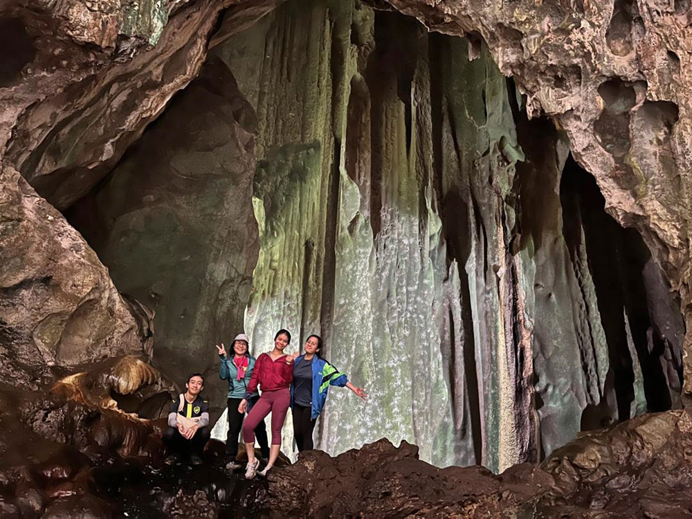 The hikers pose for a photo in Silabur Cave. 