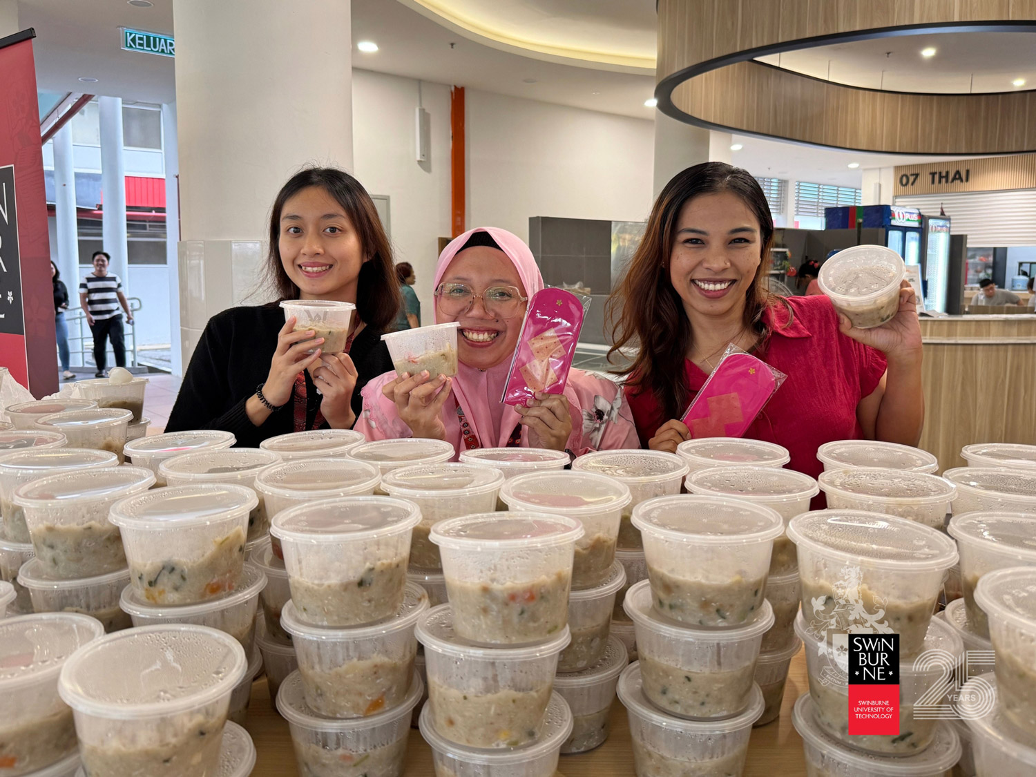 Staff with their bubur lambuk. 